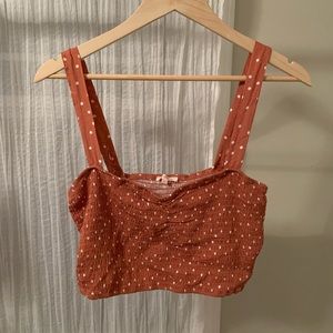 Pink Polka Dot smocked crop top from PacSun